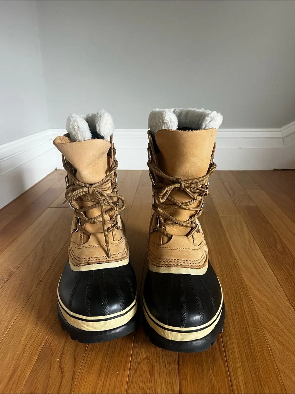 Sorel Tan and Black Caribou Winter Boots